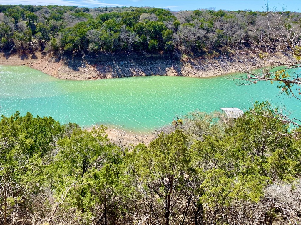 26701 Blue Cove Road Marble Falls, TX 78654 - Photo 4 of 27 a view of a lake with a yard