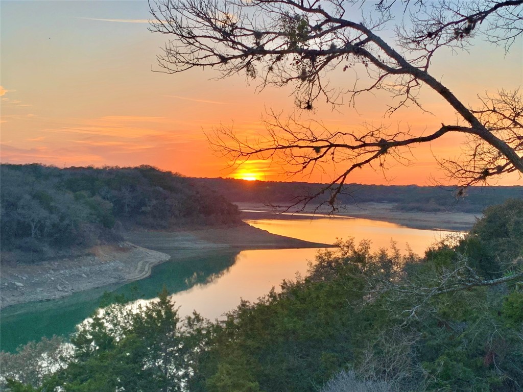 26701 Blue Cove Road Marble Falls, TX 78654 - Photo 5 of 27 a view of tree in front of a house