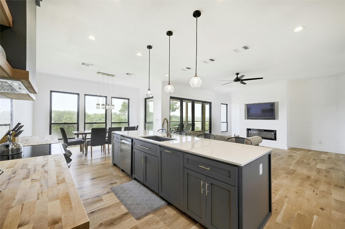 26701 Blue Cove Road Marble Falls, TX 78654 - Photo 27 of 27 a large kitchen with kitchen island a large counter space a sink appliances and a large window