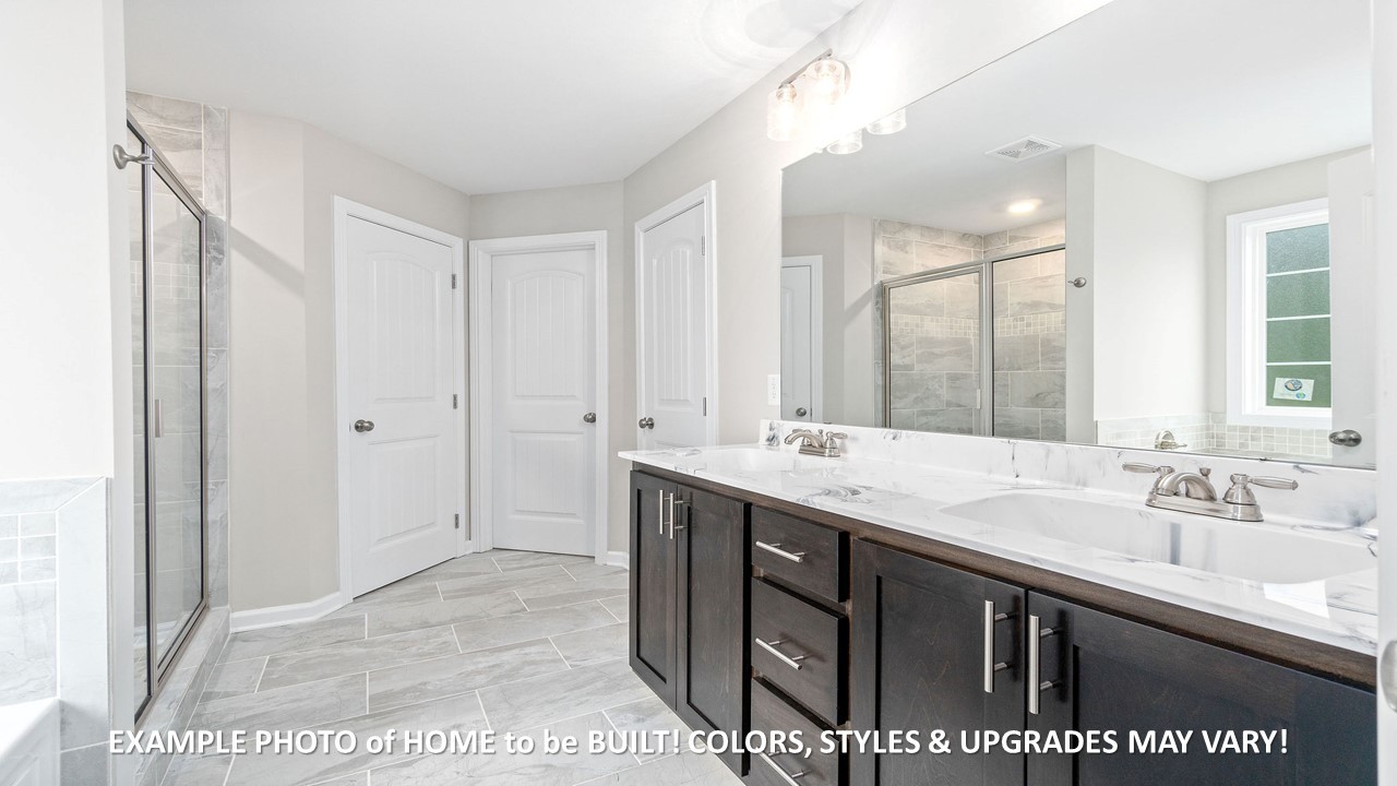 1830 McWhorter Road Cunningham, TN 37052 - Photo 16 of 46 a bathroom with a sink a mirror and a shower