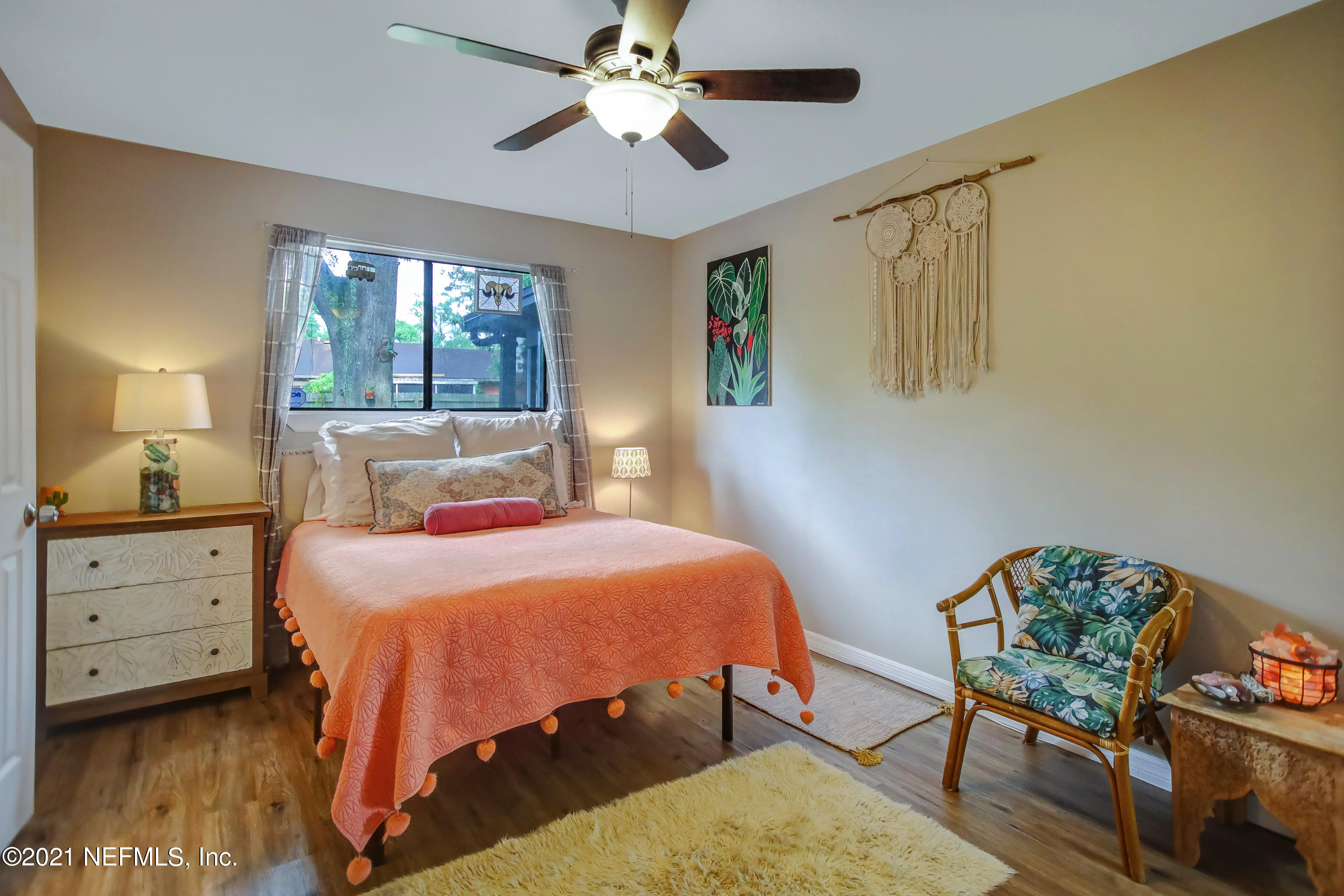 2587 Summer Tree Road East Jacksonville, FL 32246 - Photo 29 of 58 a bedroom with a bed and a dresser in it