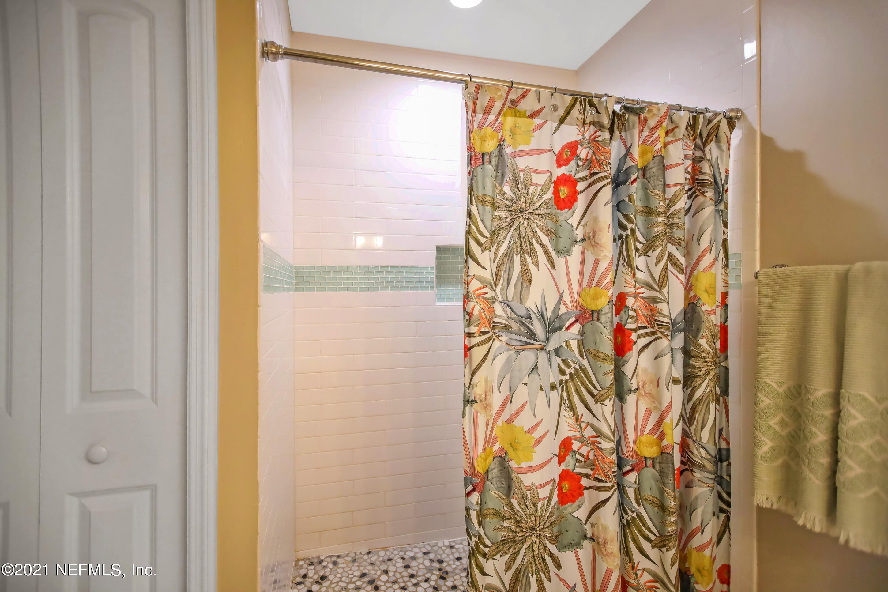 2587 Summer Tree Road East Jacksonville, FL 32246 - Photo 32 of 58 a bathroom with a shower curtain and a curtain