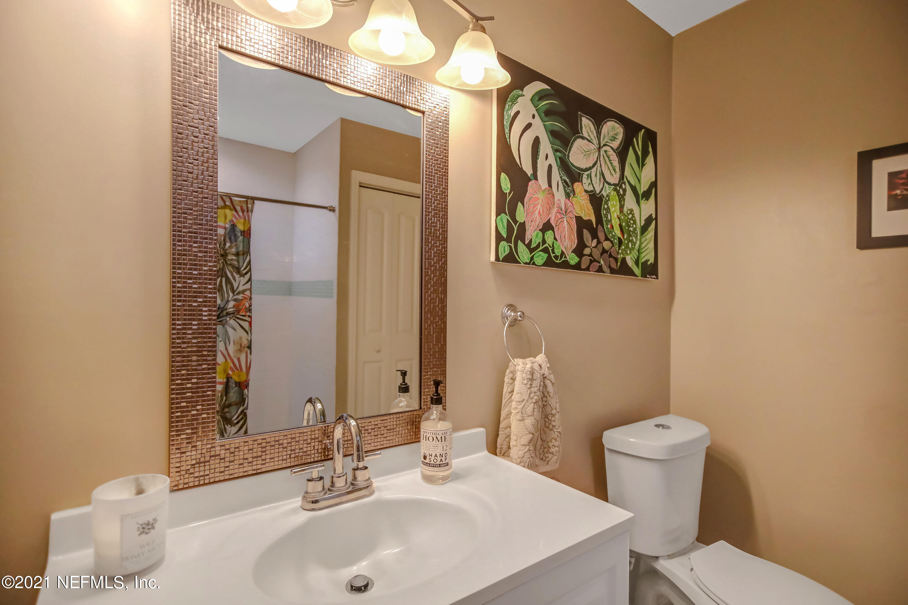 2587 Summer Tree Road East Jacksonville, FL 32246 - Photo 33 of 58 a bathroom with a sink and a mirror