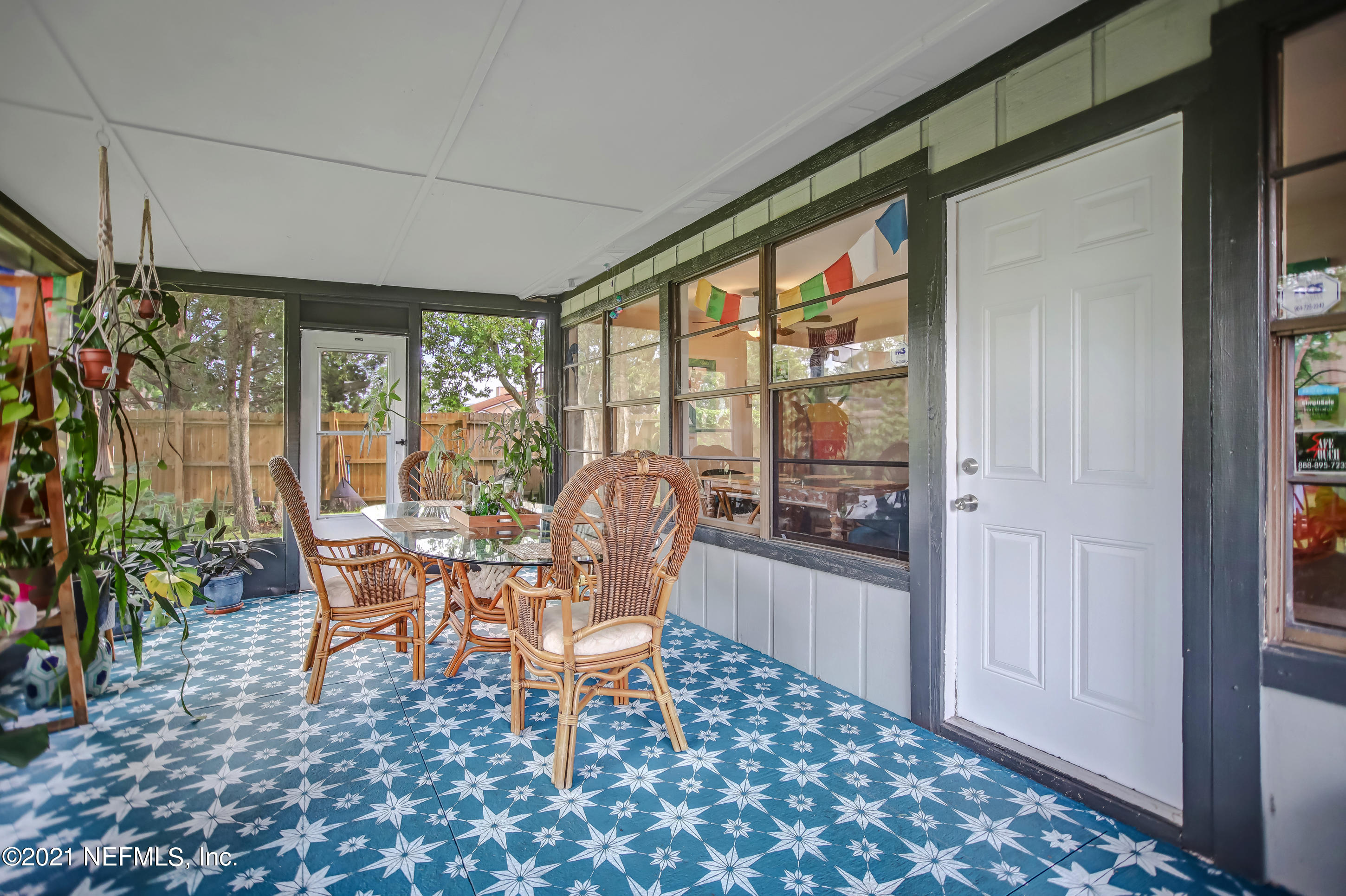 2587 Summer Tree Road East Jacksonville, FL 32246 - Photo 42 of 58 a dining room with furniture and large windows