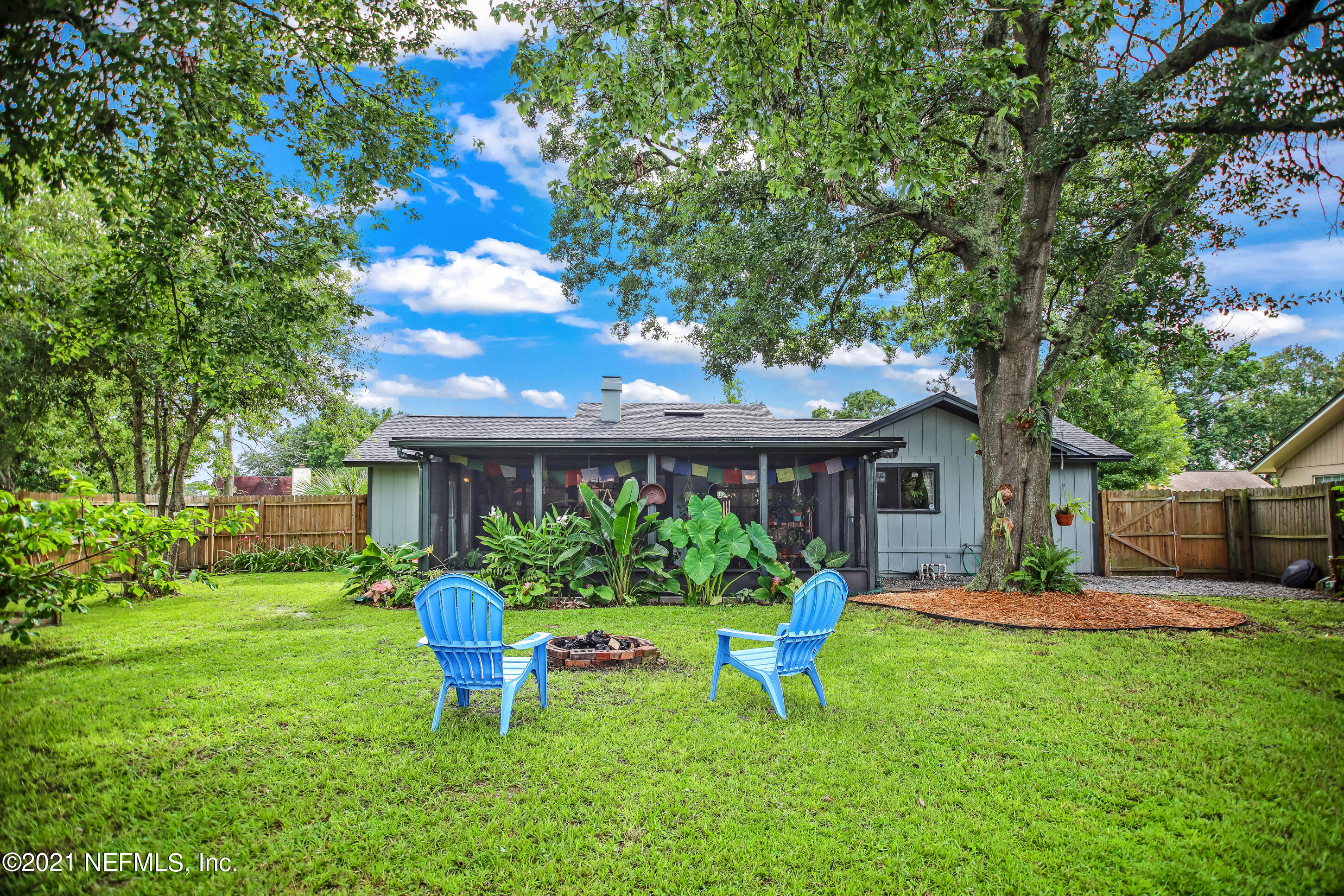 2587 Summer Tree Road East Jacksonville, FL 32246 - Photo 53 of 58 a front view of house with yard and outdoor seating