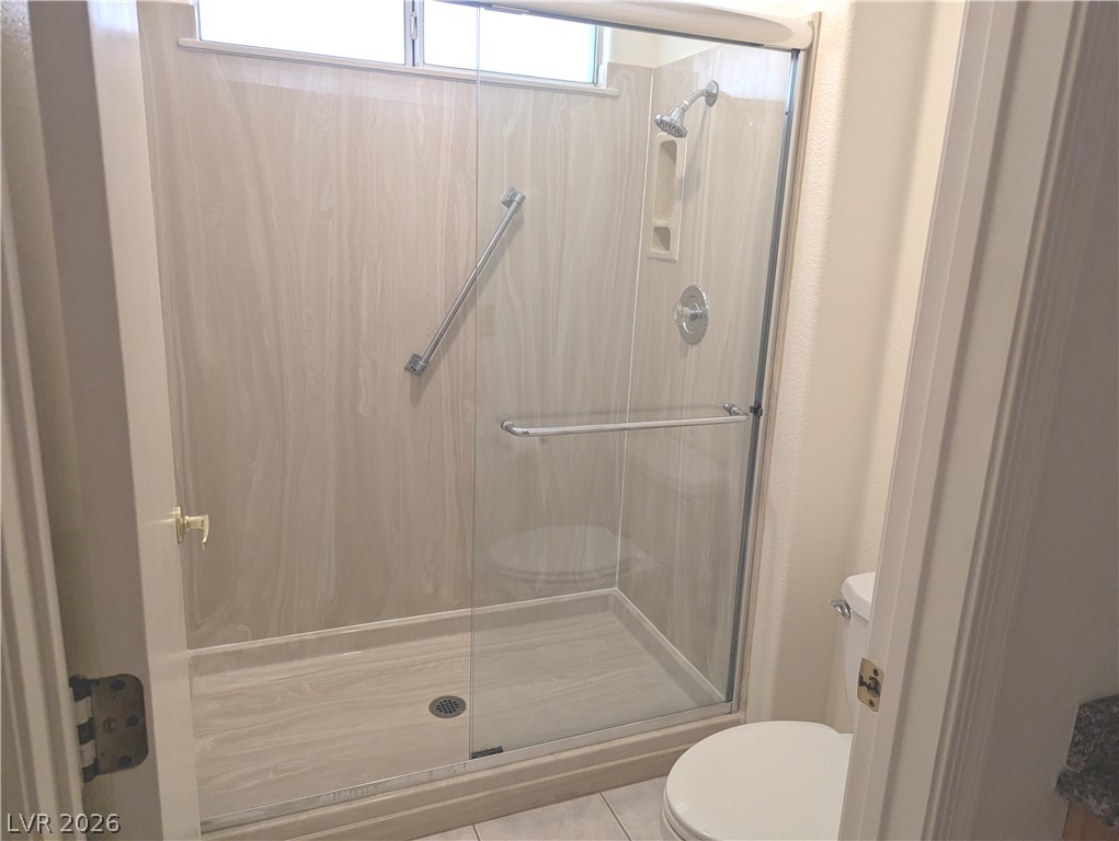 9433 Quail Ridge Drive Las Vegas, NV 89134 - Photo 11 of 23 A well-appointed shower stall features a clean, modern design.