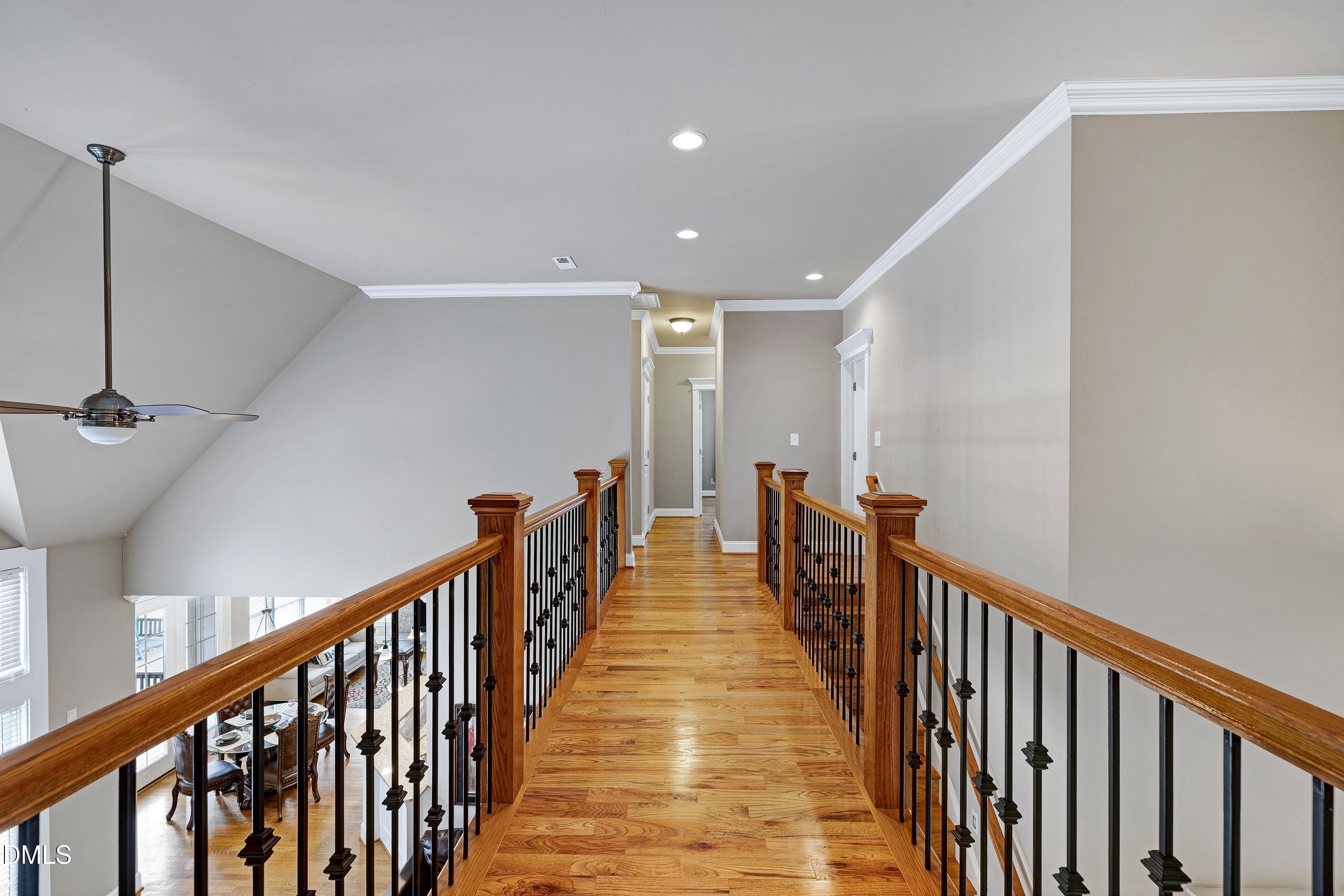 14212 Careme Court Wake Forest, NC 27587 - Photo 23 of 54 a view of a hallway with wooden floor