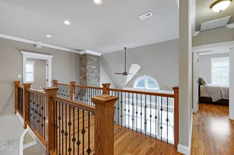 a view of entryway and hall with wooden floor