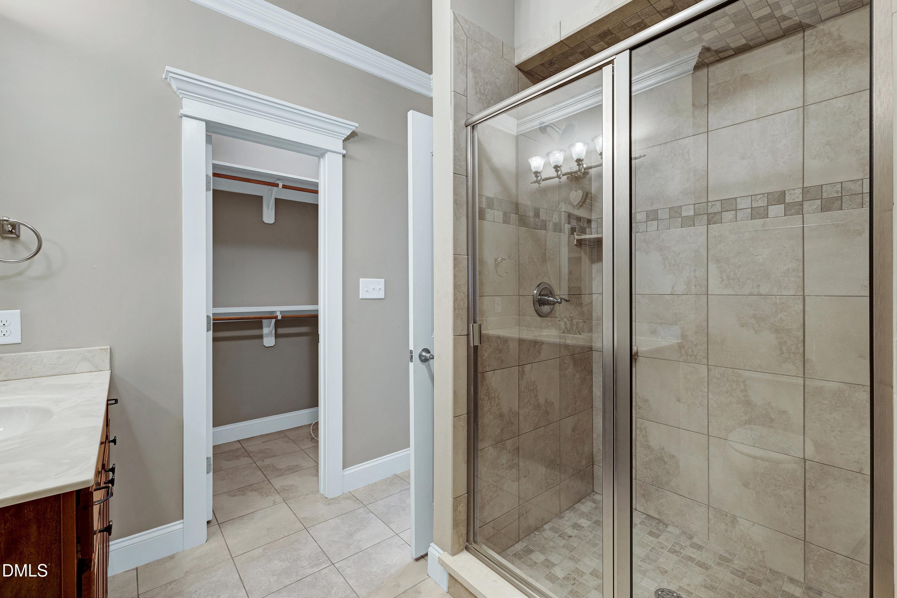 14212 Careme Court Wake Forest, NC 27587 - Photo 26 of 54 a bathroom with a shower
