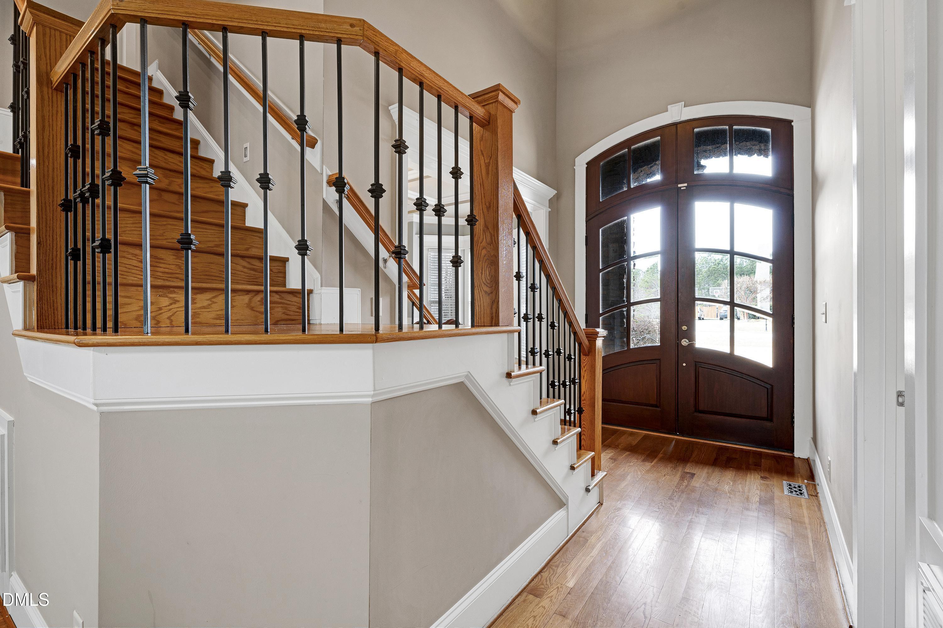 14212 Careme Court Wake Forest, NC 27587 - Photo 3 of 54 a view of staircase with lots of frames on wall and a window
