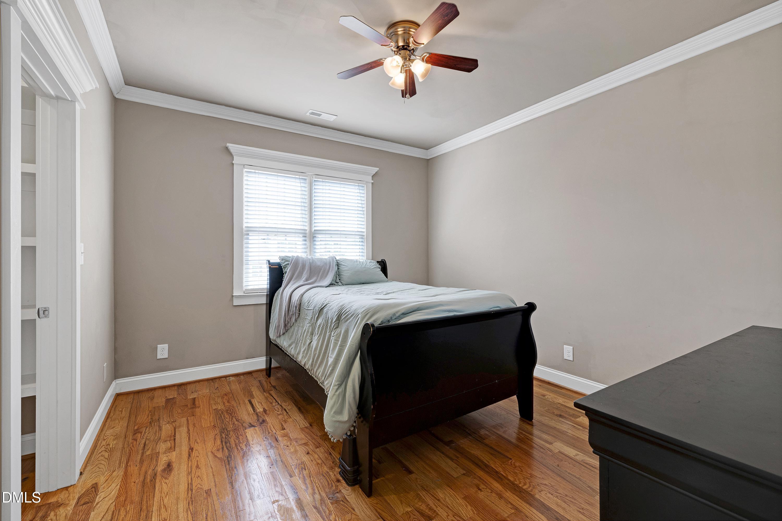 14212 Careme Court Wake Forest, NC 27587 - Photo 34 of 54 a bed sitting in a bedroom next to a window