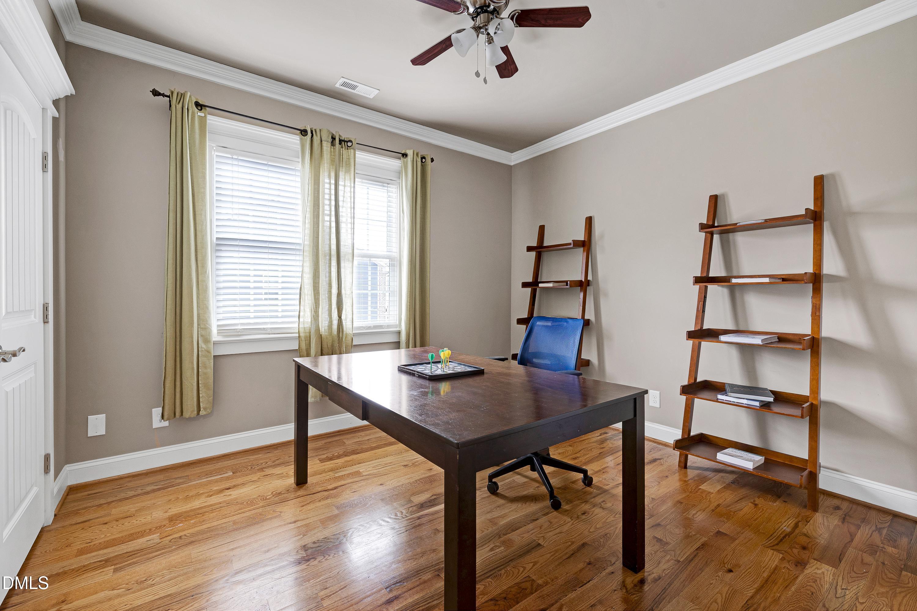 14212 Careme Court Wake Forest, NC 27587 - Photo 37 of 54 a view of a workspace with furniture and a window