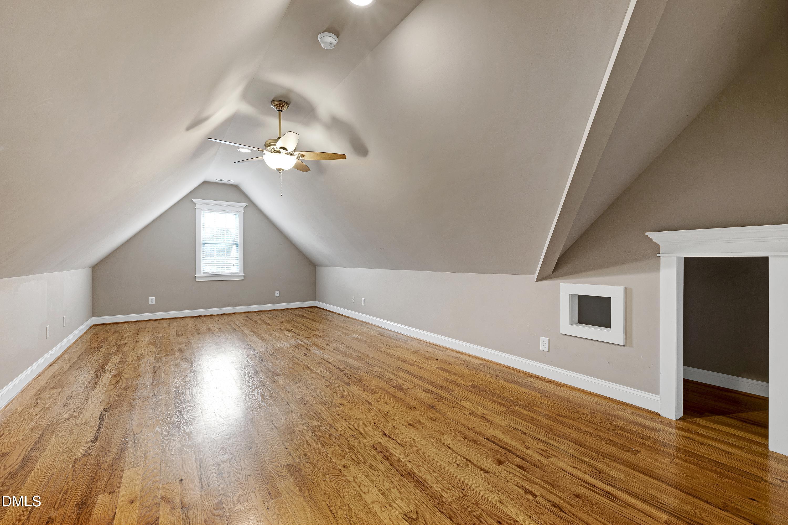14212 Careme Court Wake Forest, NC 27587 - Photo 38 of 54 wooden floor in an empty room with a window
