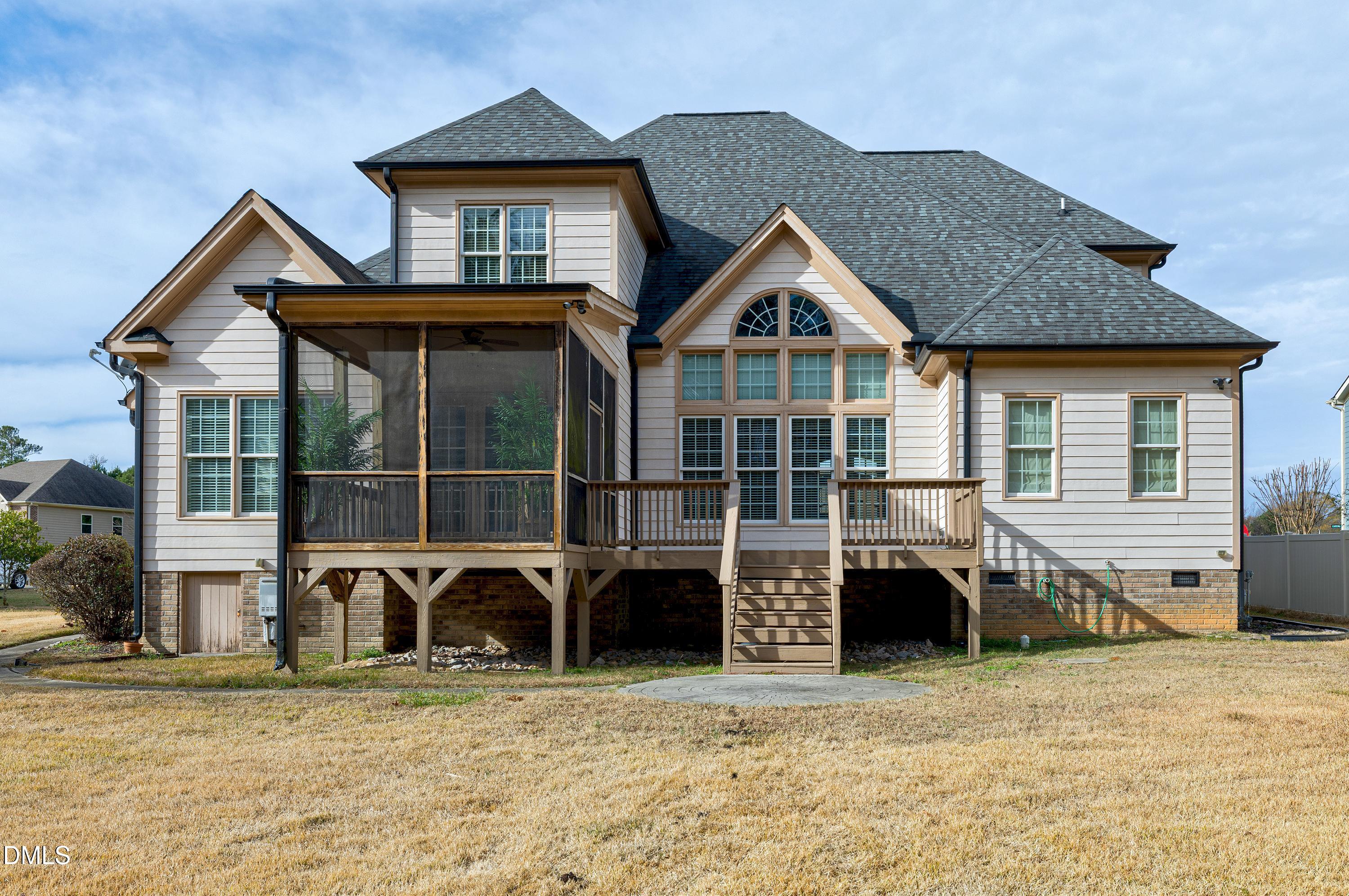14212 Careme Court Wake Forest, NC 27587 - Photo 45 of 54 a view of a house with a patio and a yard