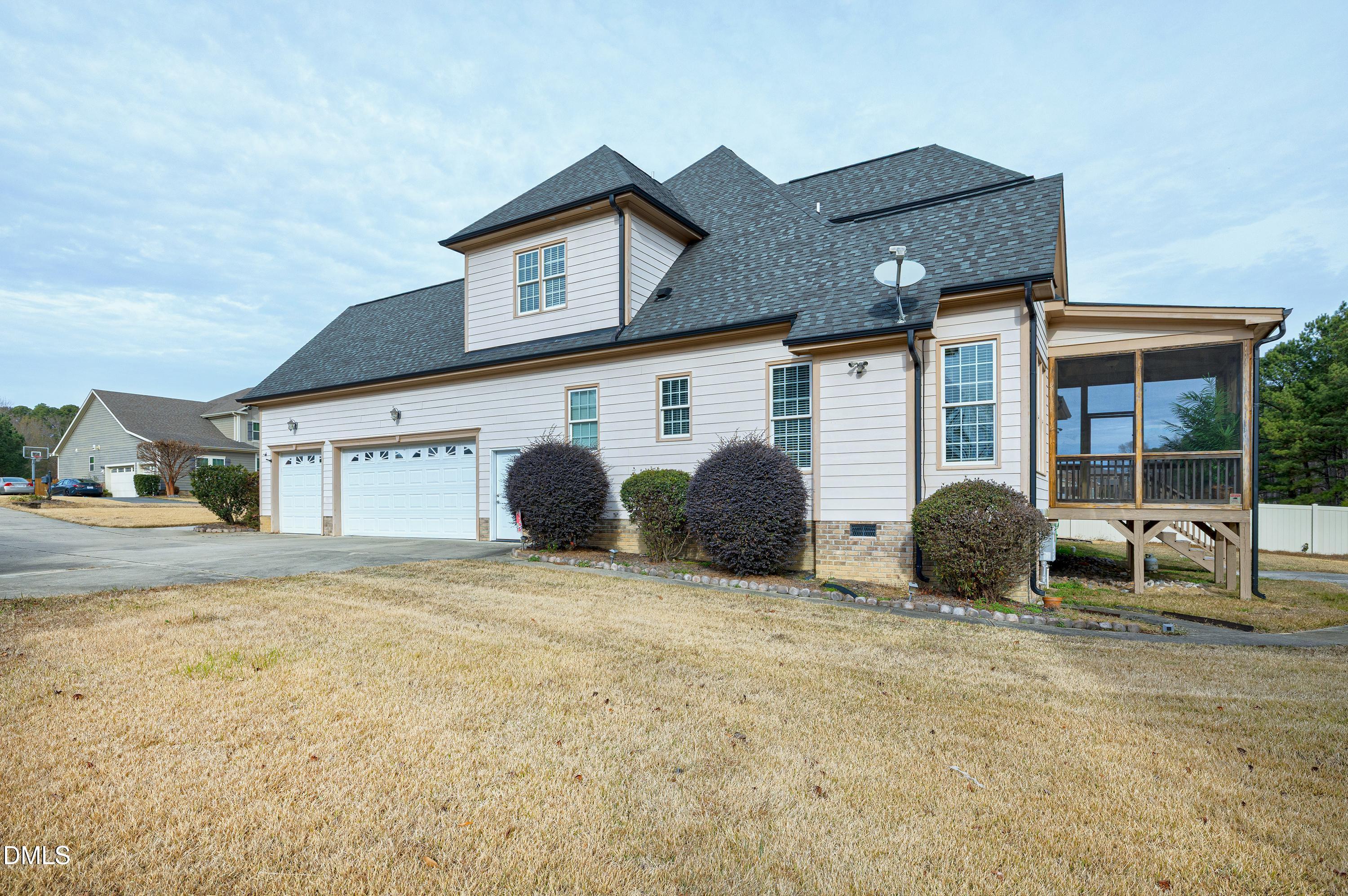 14212 Careme Court Wake Forest, NC 27587 - Photo 49 of 54 a view of a house with backyard and roof
