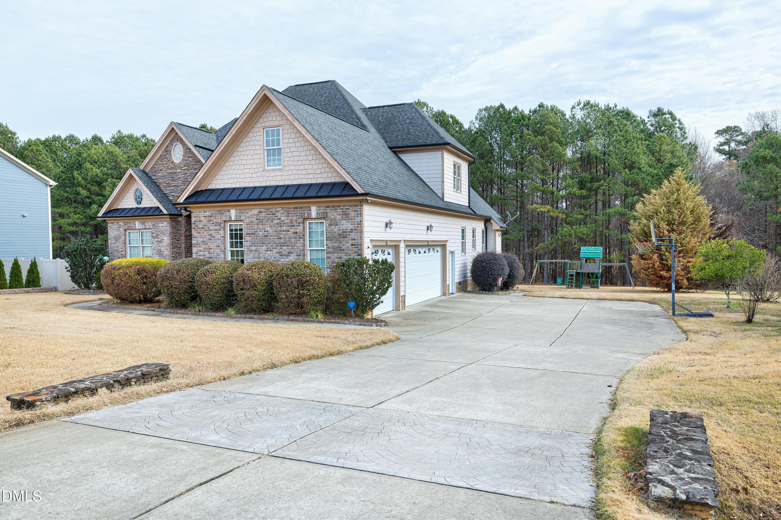 14212 Careme Court Wake Forest, NC 27587 - Photo 50 of 54 a front view of a house with a yard