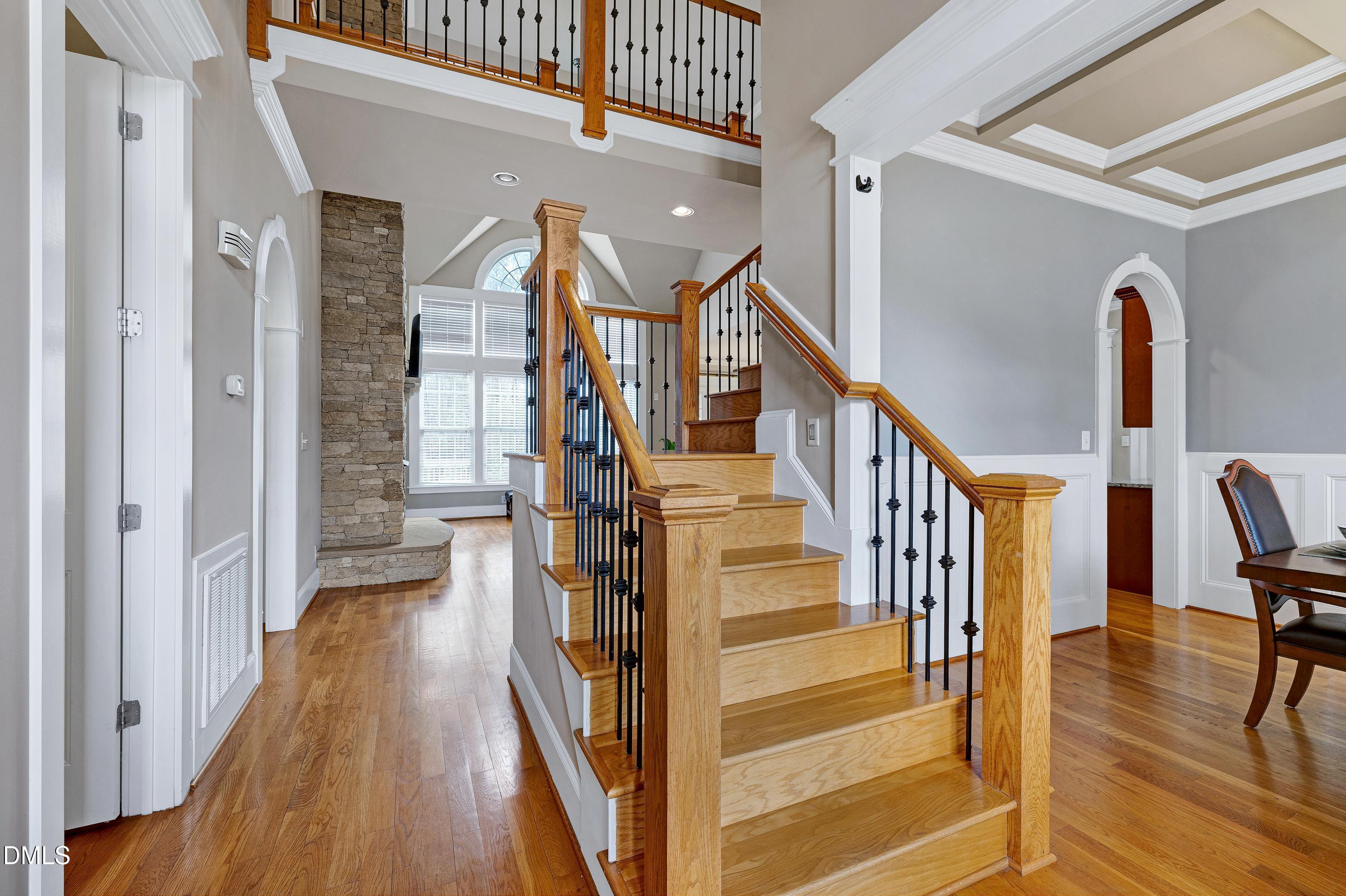 14212 Careme Court Wake Forest, NC 27587 - Photo 6 of 54 a view of a hallway with wooden floor and staircase