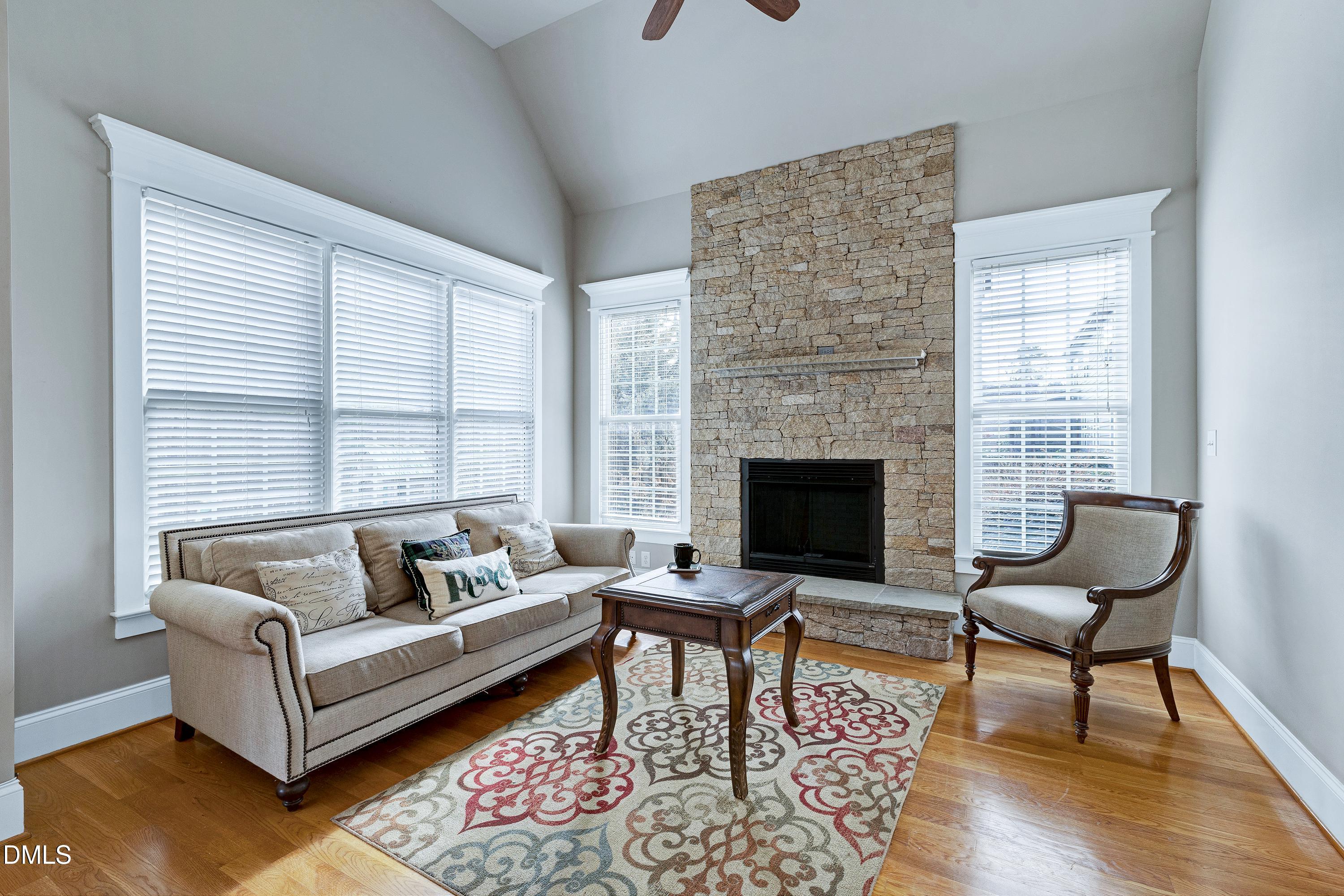 14212 Careme Court Wake Forest, NC 27587 - Photo 7 of 54 a living room with furniture and a fireplace