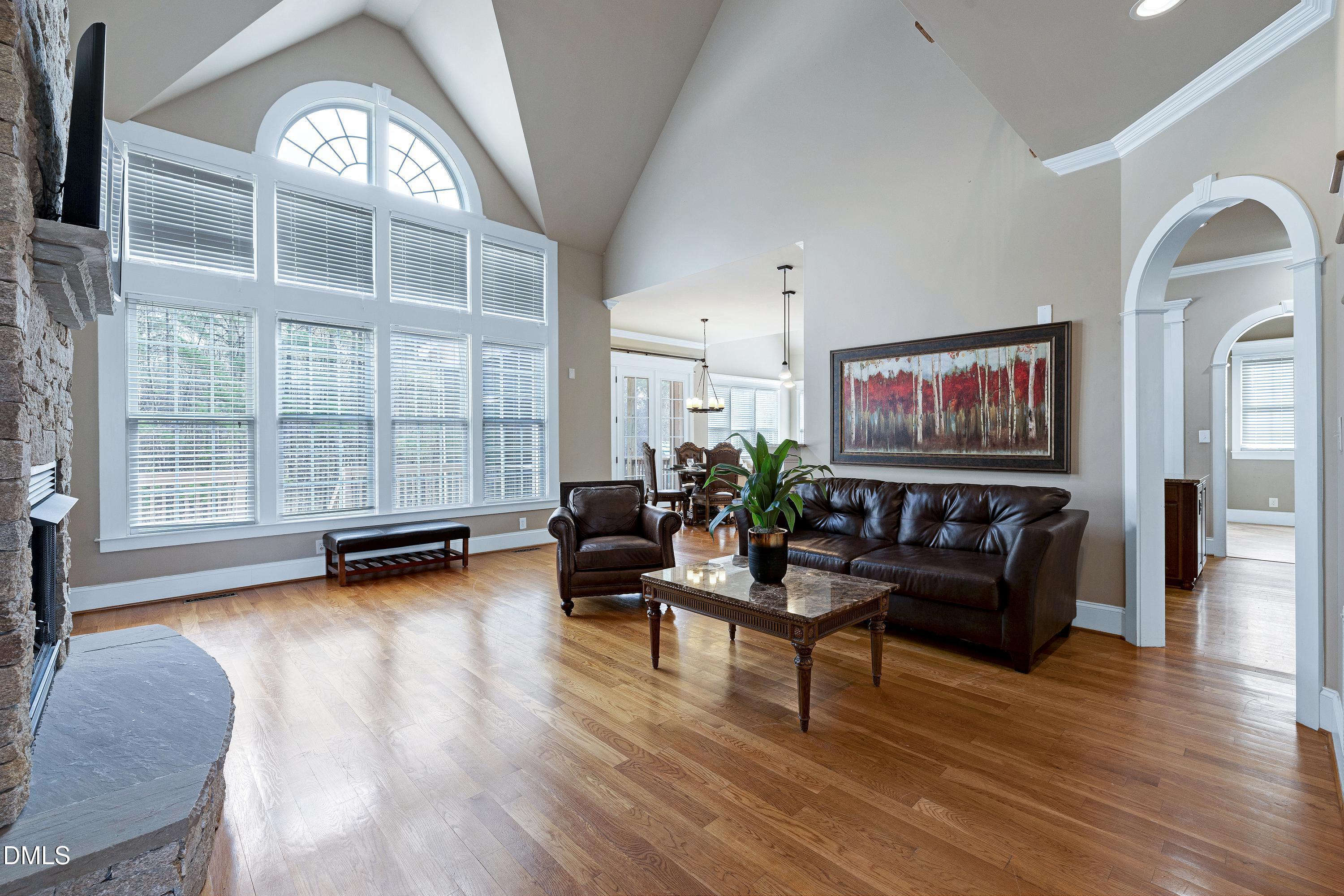 14212 Careme Court Wake Forest, NC 27587 - Photo 8 of 54 a living room with furniture and a floor to ceiling window