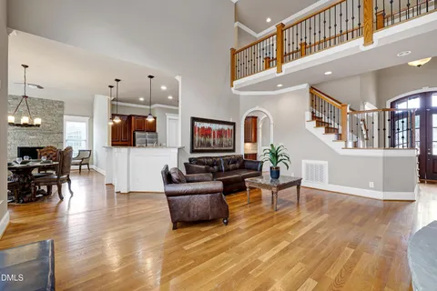 a living room with fireplace furniture and a flat screen tv