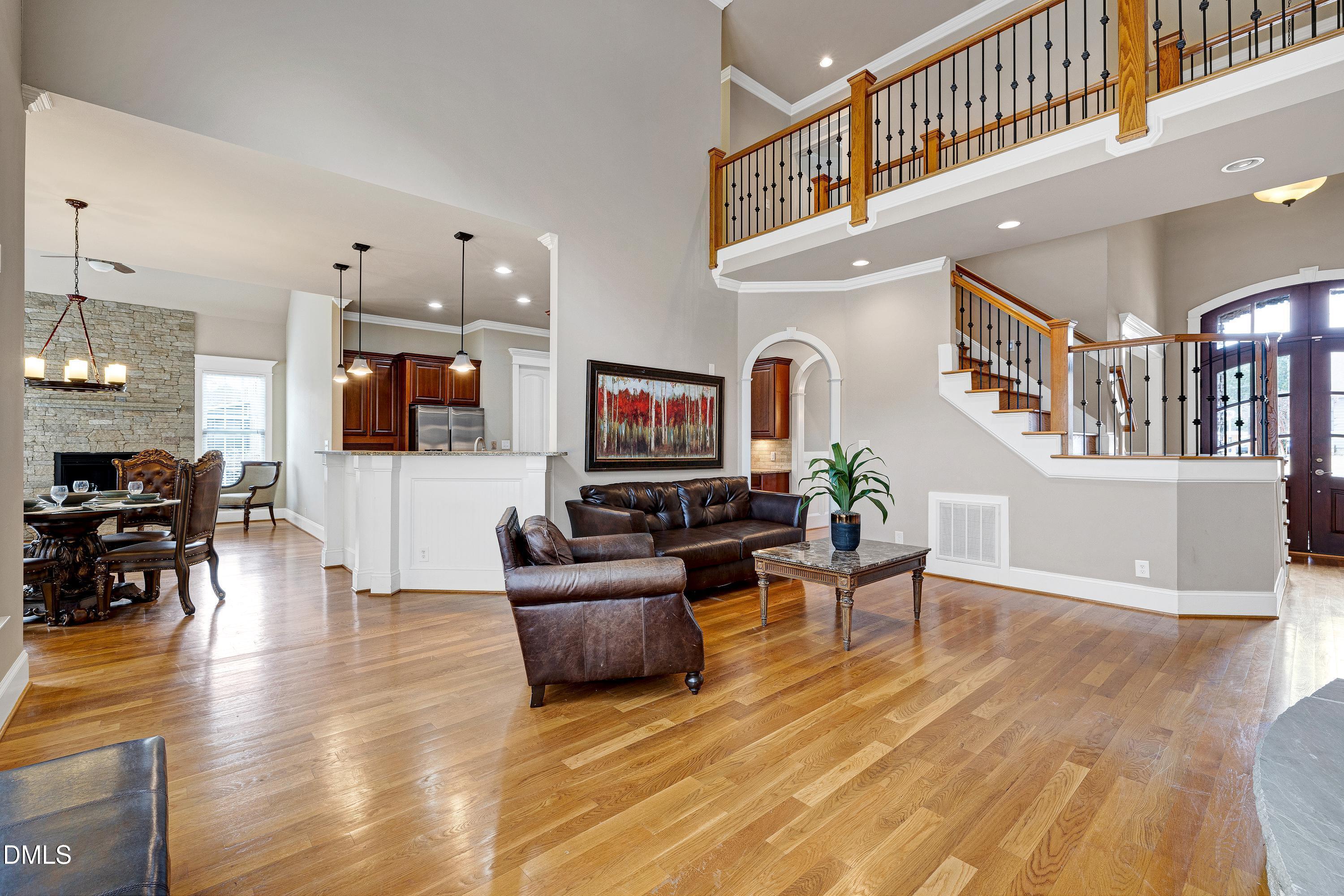 14212 Careme Court Wake Forest, NC 27587 - Photo 10 of 54 a living room with fireplace furniture and a flat screen tv