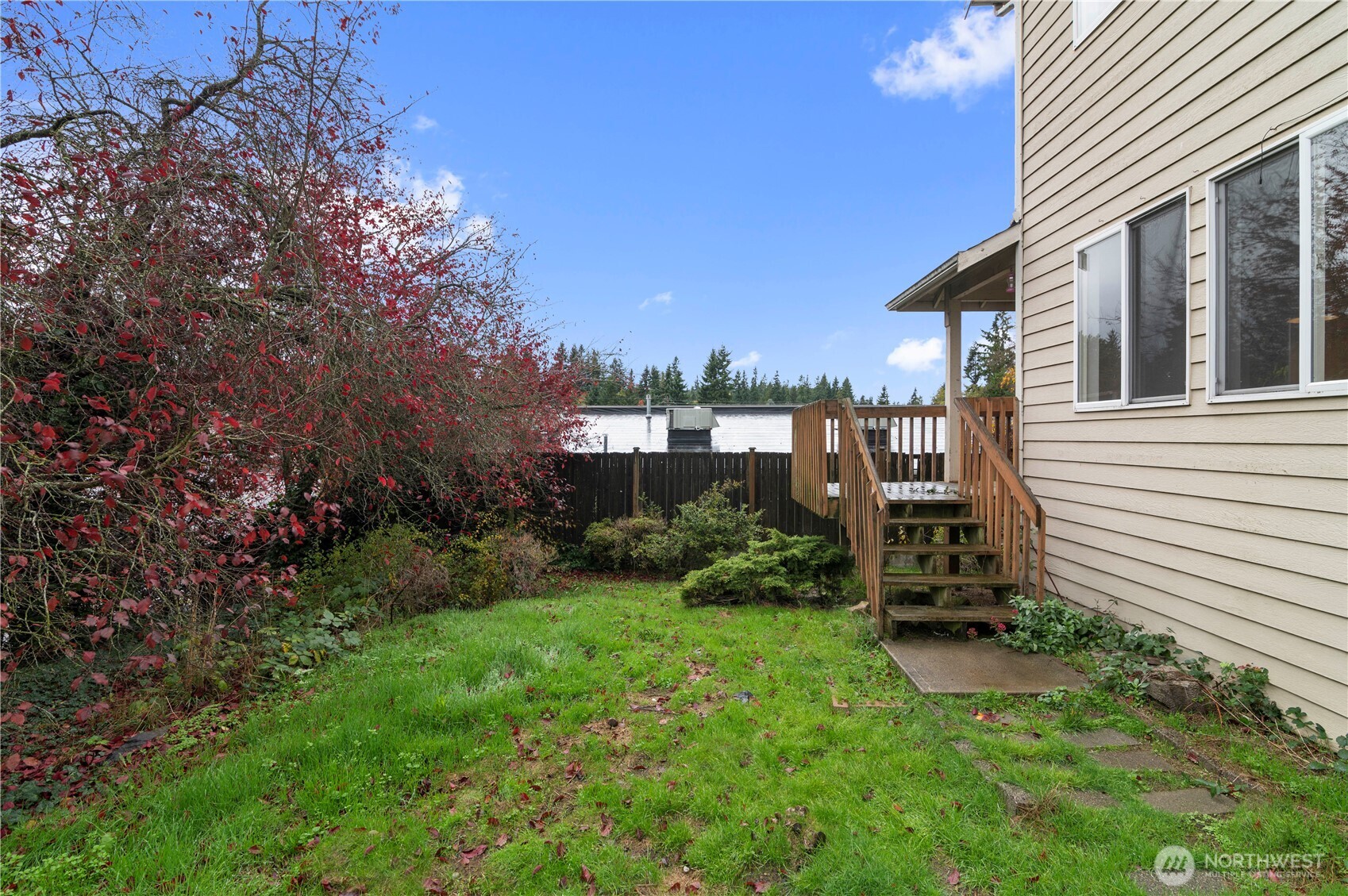 4733 Carlton Road Everett, WA 98203 - Photo 22 of 23 a view of a chair and table in backyard of the house