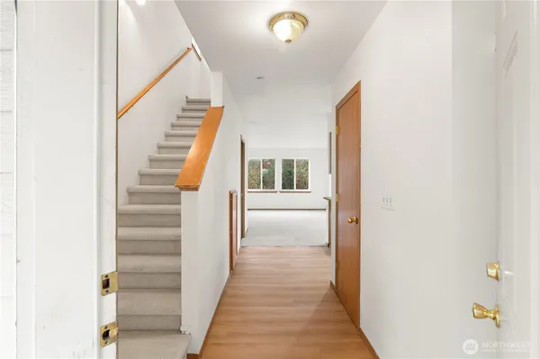 a view of a hallway with staircase