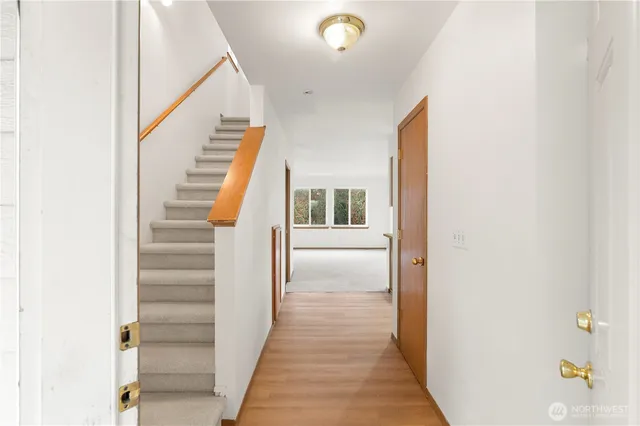 a view of a hallway with staircase