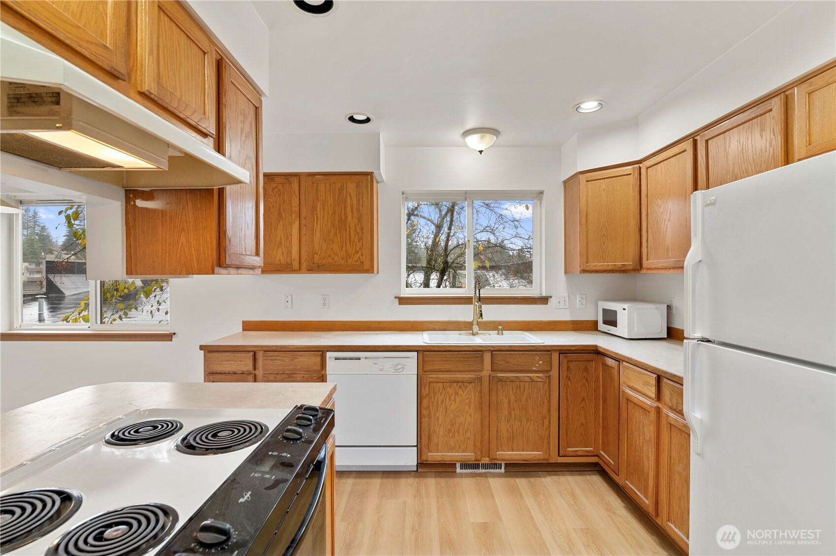 4733 Carlton Road Everett, WA 98203 - Photo 7 of 23 a kitchen with stainless steel appliances granite countertop a sink stove and refrigerator