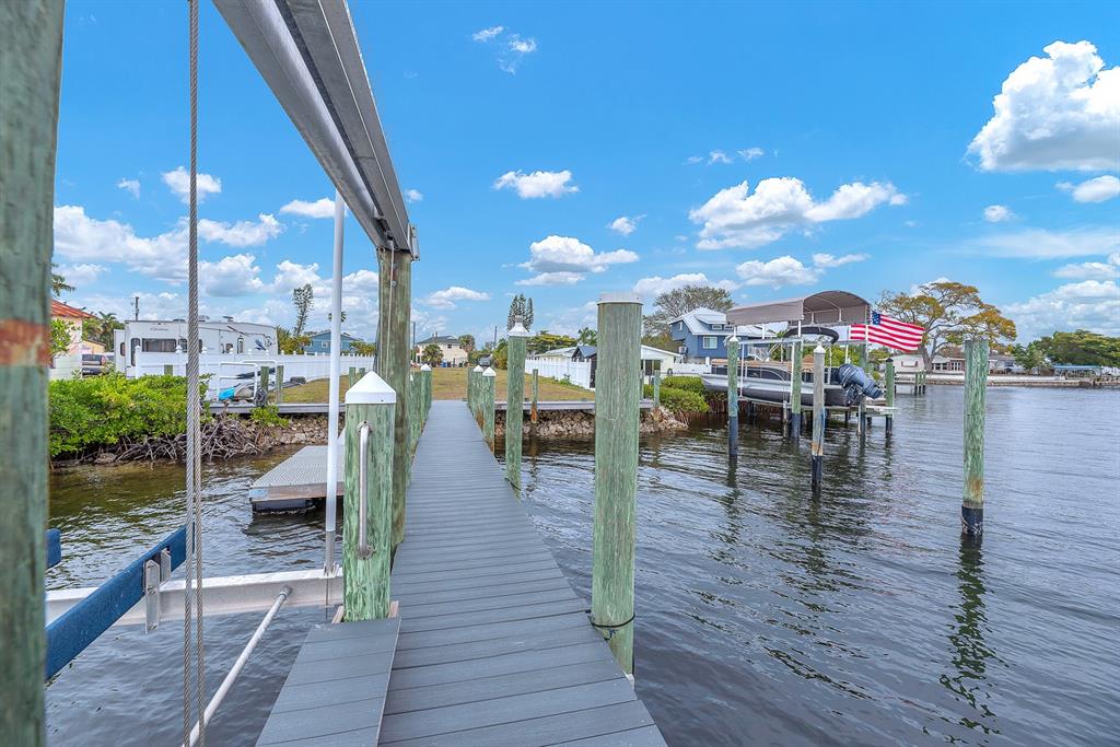 3304 West Shell Point Road Ruskin, FL 33570 - Photo 15 of 23 a view of a balcony with dining table & chairs