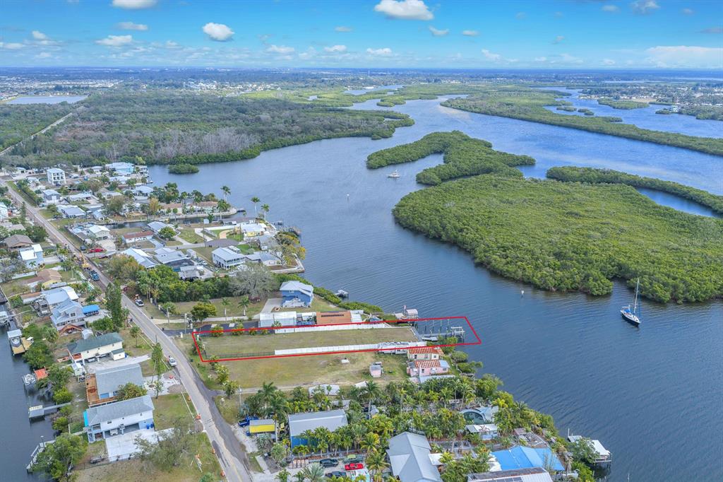 3304 West Shell Point Road Ruskin, FL 33570 - Photo 2 of 23 a view of a lake with a mountain in the background