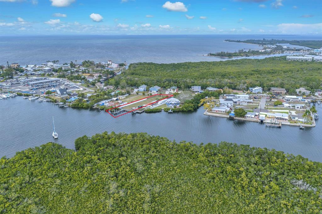 3304 West Shell Point Road Ruskin, FL 33570 - Photo 23 of 23 an aerial view of a house with garden space and lake view