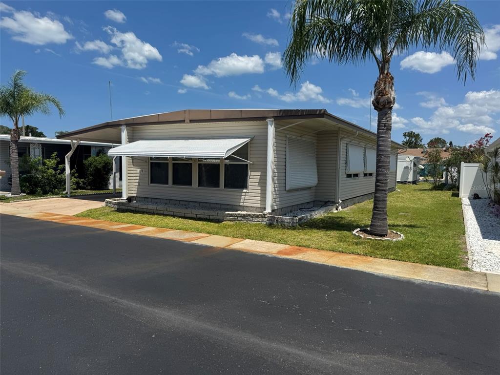 3301 Alt 19, Unit 314 Dunedin, FL 34698 - Photo 1 of 11 a view of a house with swimming pool