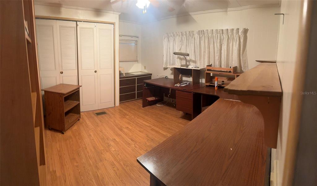 3301 Alt 19, Unit 314 Dunedin, FL 34698 - Photo 7 of 11 a bed room with a bed furniture and a window
