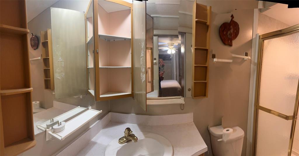 3301 Alt 19, Unit 314 Dunedin, FL 34698 - Photo 9 of 11 a bathroom with a tub and shower