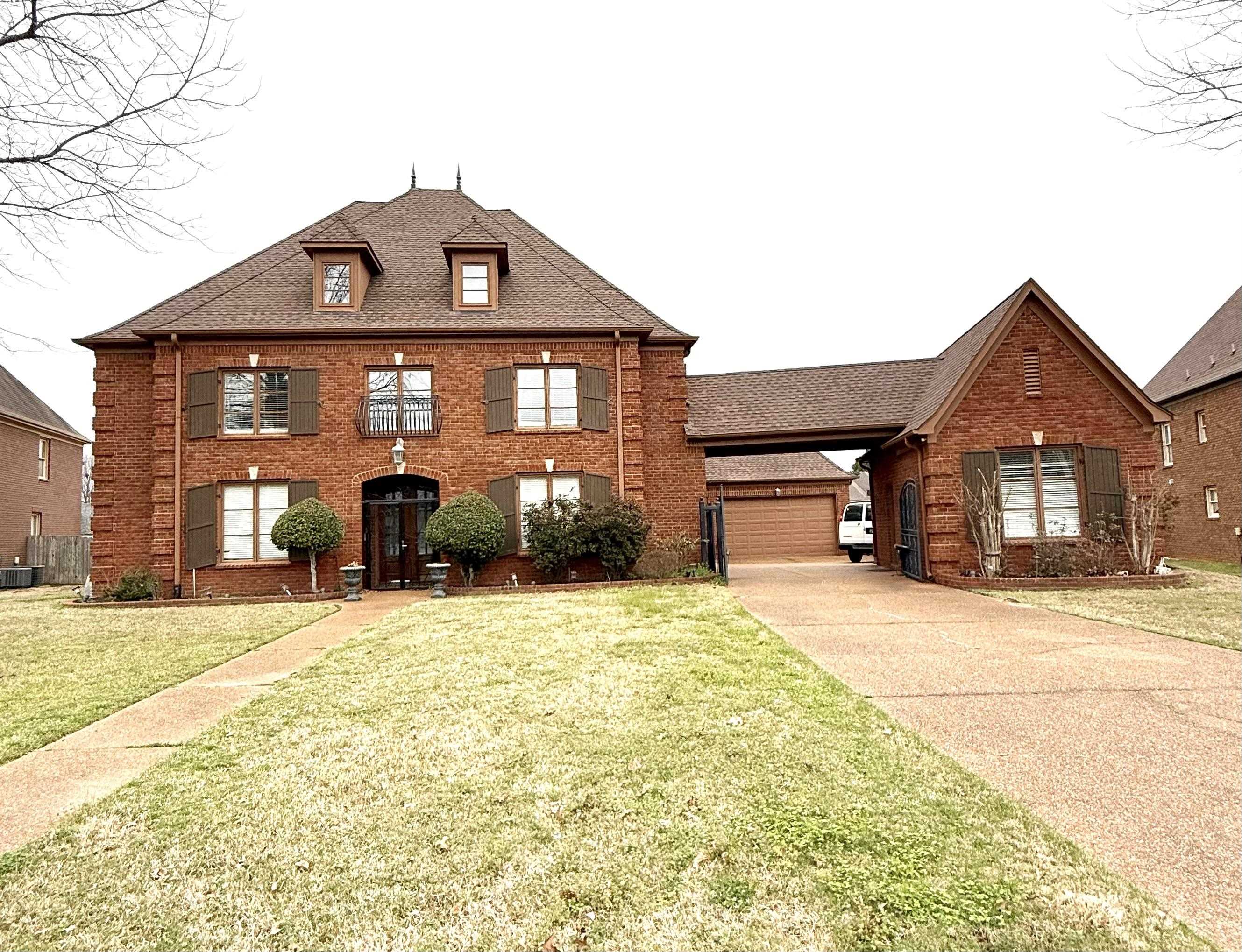 4447 Whisper Spring Drive Collierville, TN 38017 - Photo 1 of 4 a front view of a house with a yard