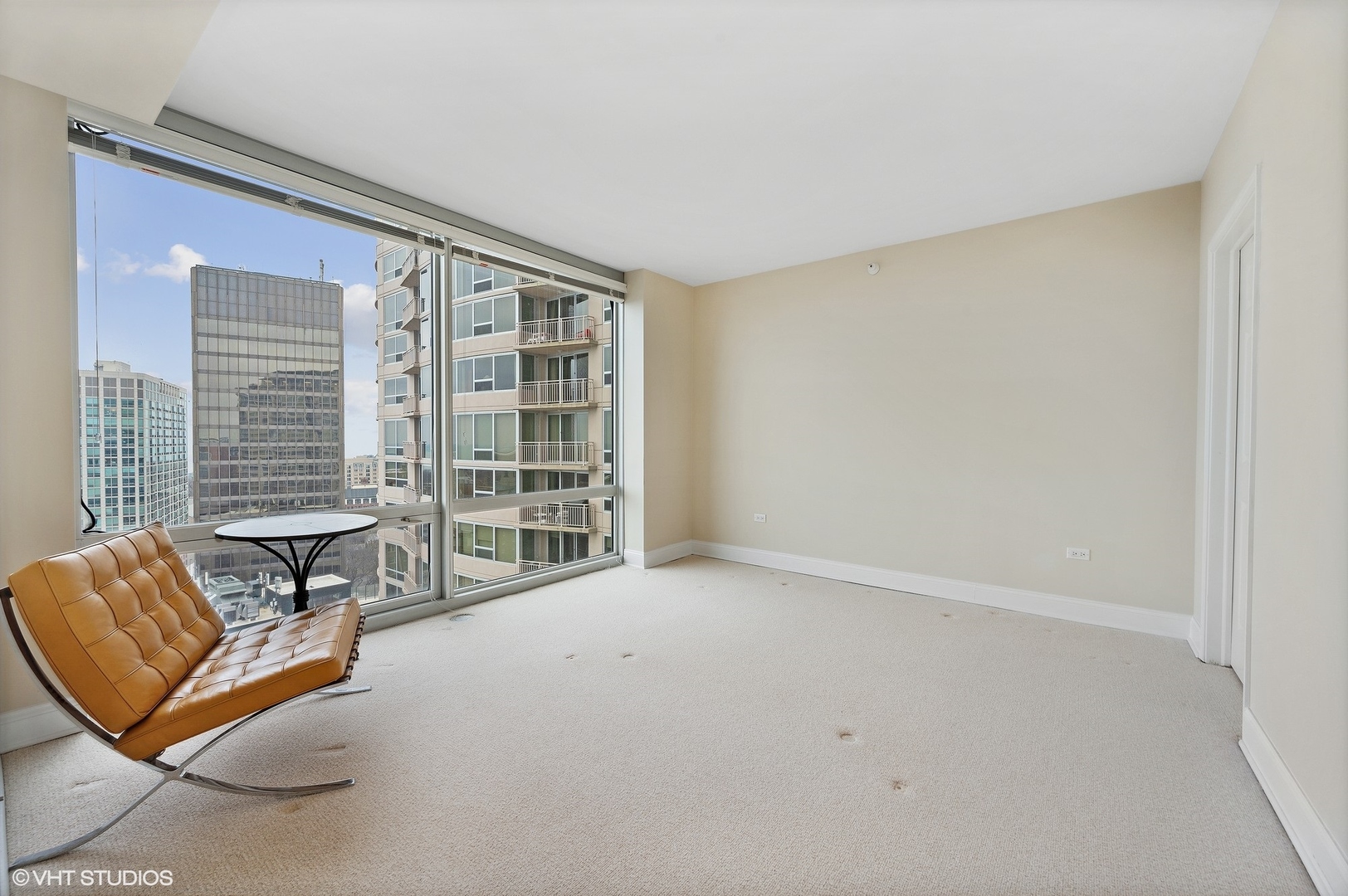 807 Davis Street, Unit 1610 Evanston, IL 60201 - Photo 11 of 19 a living room with furniture and a large window
