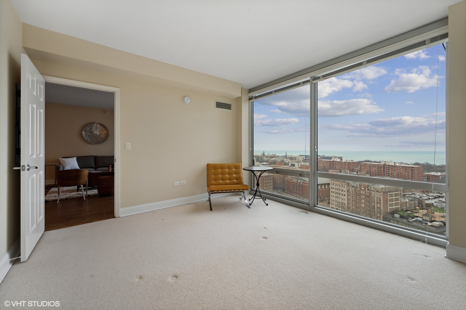 807 Davis Street, Unit 1610 Evanston, IL 60201 - Photo 12 of 19 an empty room with sliding door and a floor to ceiling window