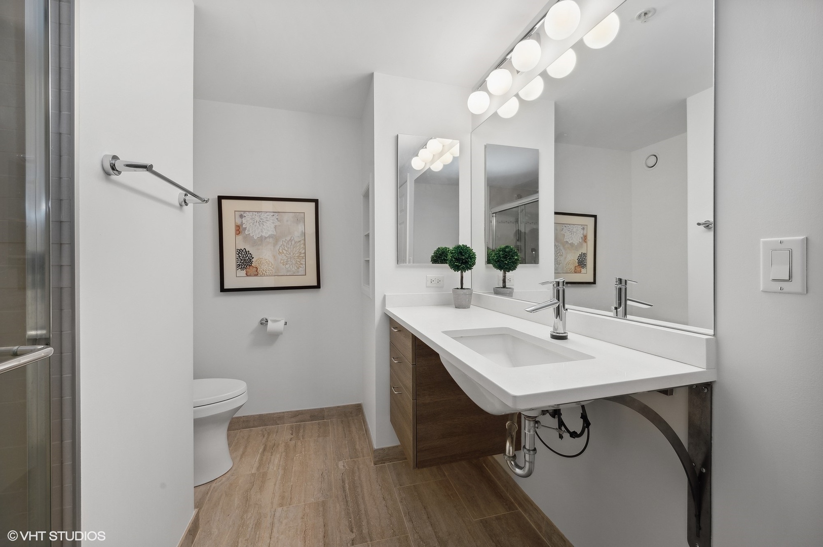 807 Davis Street, Unit 1610 Evanston, IL 60201 - Photo 13 of 19 a view of a bathroom sink and mirror