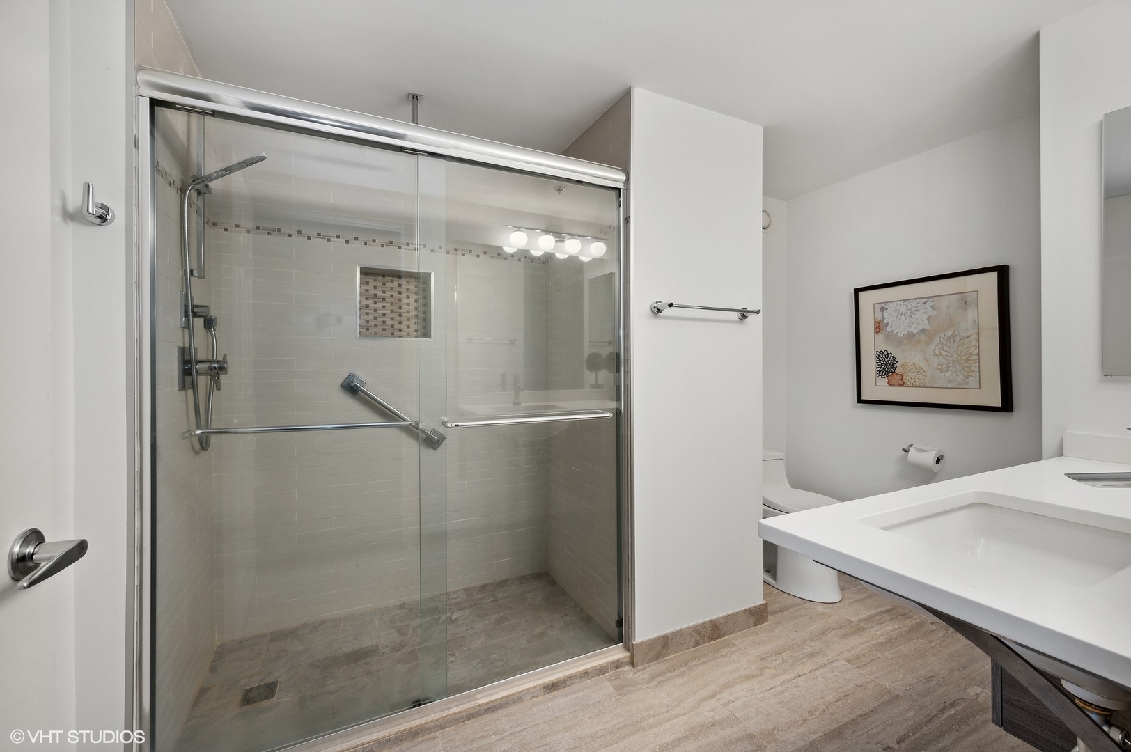 807 Davis Street, Unit 1610 Evanston, IL 60201 - Photo 14 of 19 a bathroom with a shower and a sink