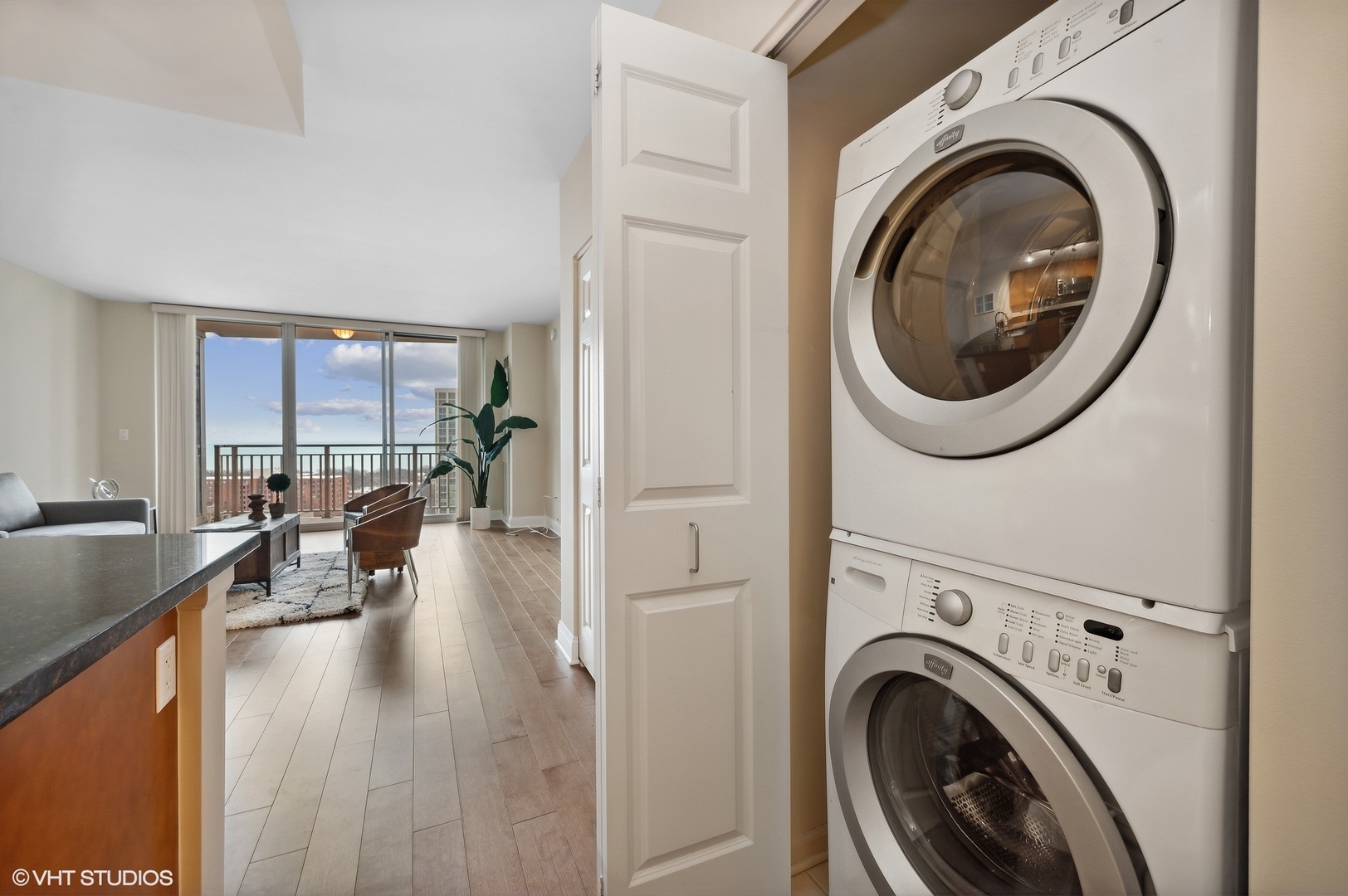 807 Davis Street, Unit 1610 Evanston, IL 60201 - Photo 16 of 19 a view of a hallway with washer and dryer