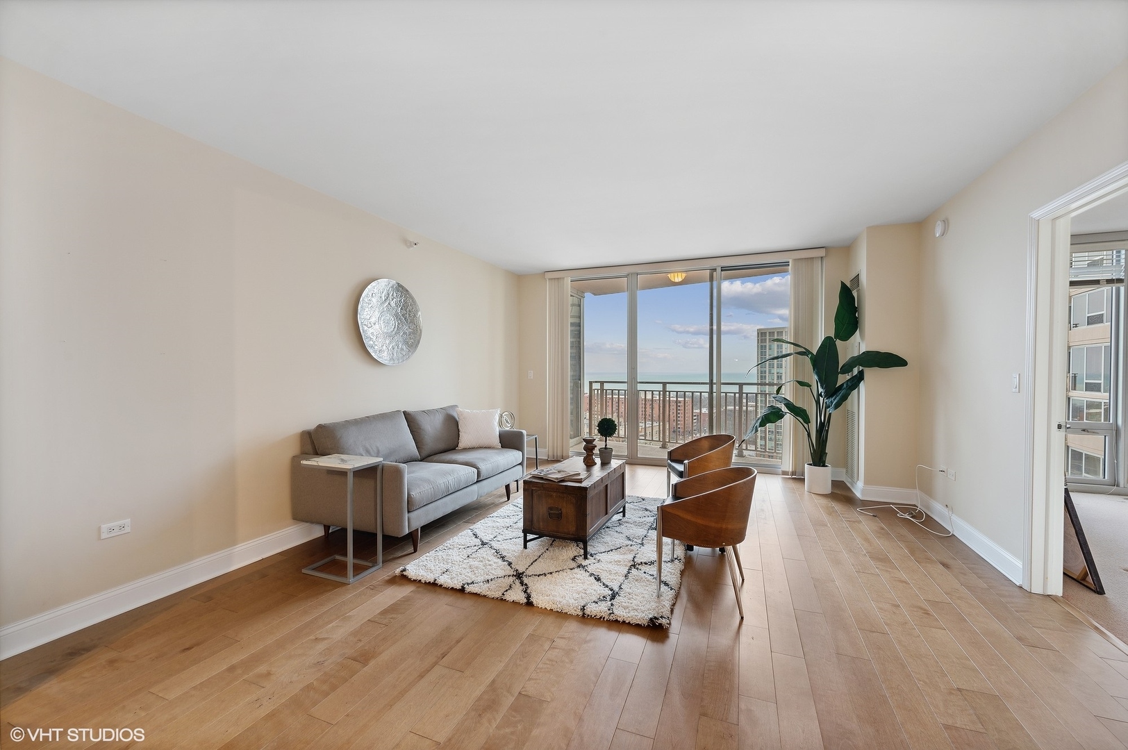 807 Davis Street, Unit 1610 Evanston, IL 60201 - Photo 4 of 19 a living room with furniture and a large window