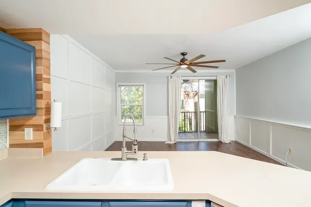 a view of a balcony with a yard