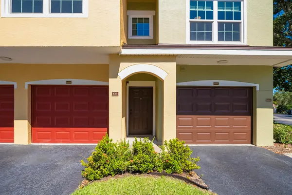 a kitchen with stainless steel appliances kitchen island granite countertop a refrigerator and a stove top oven