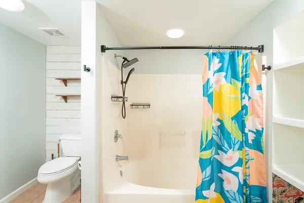 a view of a swimming pool with a table and chairs