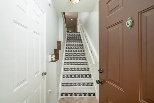 a kitchen with stainless steel appliances kitchen island granite countertop a stove and a microwave