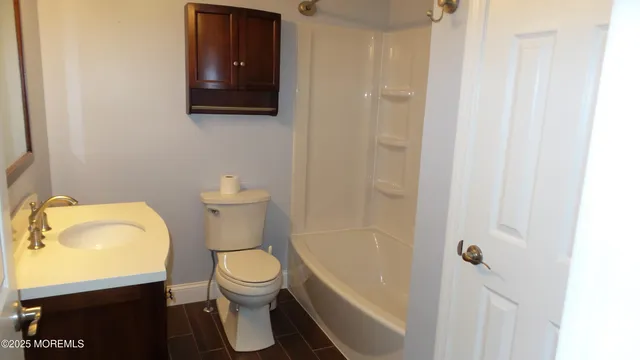 a bathroom with a toilet and a sink