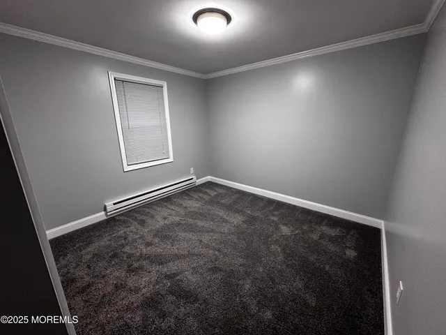 an empty room with a empty space and windows