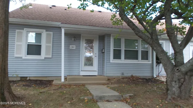 a view of a house with a tree
