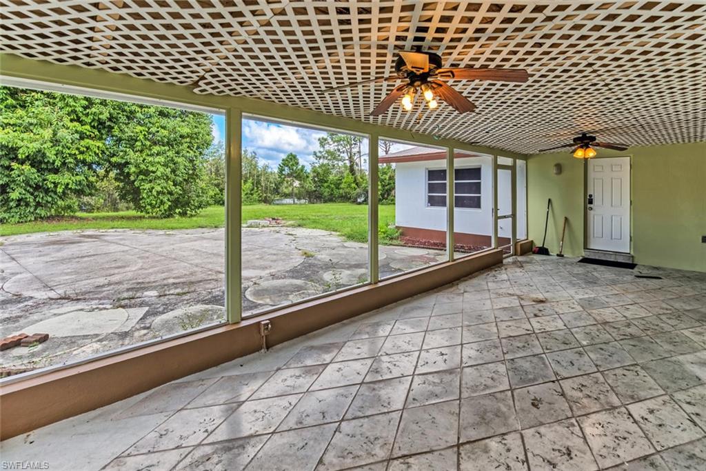 29 Caribbean Road Naples, FL 34108 - Photo 29 of 30 a view of a house with a porch